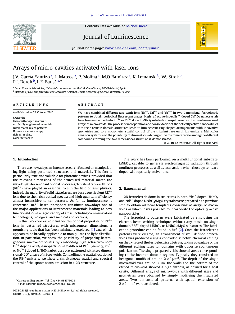 Arrays of micro-cavities activated with laser ions