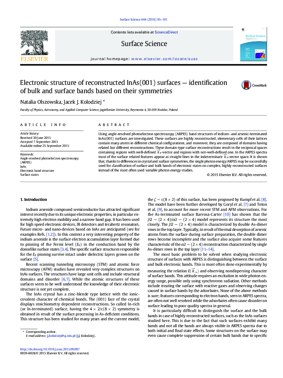 Electronic structure of reconstructed InAs(001) surfaces - identification of bulk and surface bands based on their symmetries