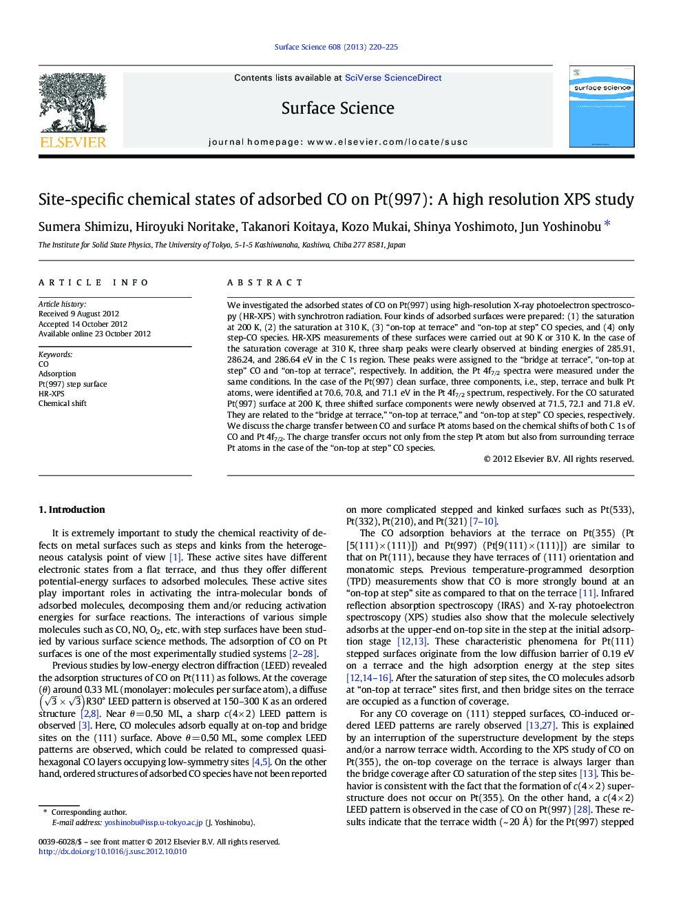 Site-specific chemical states of adsorbed CO on Pt(997): A high resolution XPS study