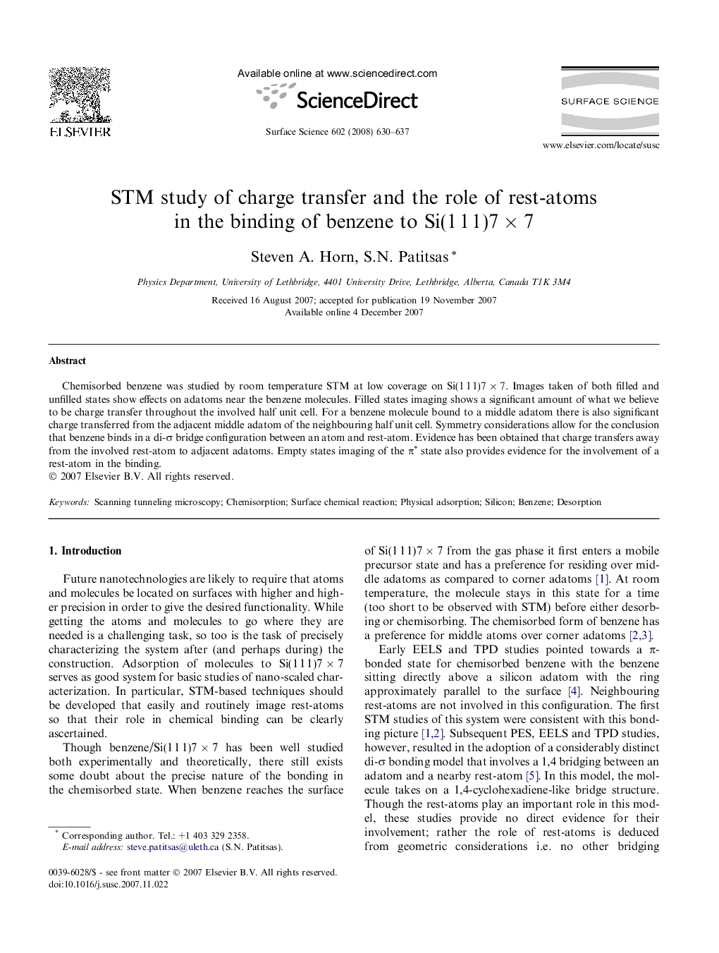 STM study of charge transfer and the role of rest-atoms in the binding of benzene to Si(1 1 1)7 Ã 7