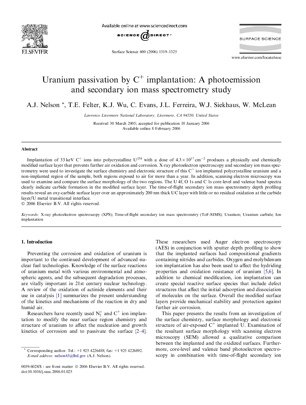 Uranium passivation by C+ implantation: A photoemission and secondary ion mass spectrometry study