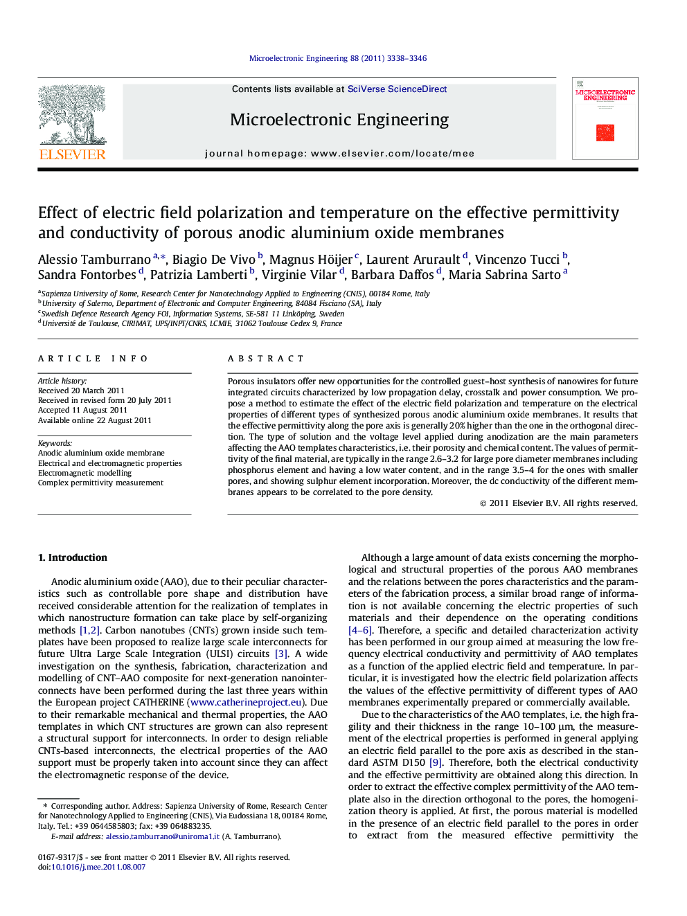 Effect of electric field polarization and temperature on the effective permittivity and conductivity of porous anodic aluminium oxide membranes