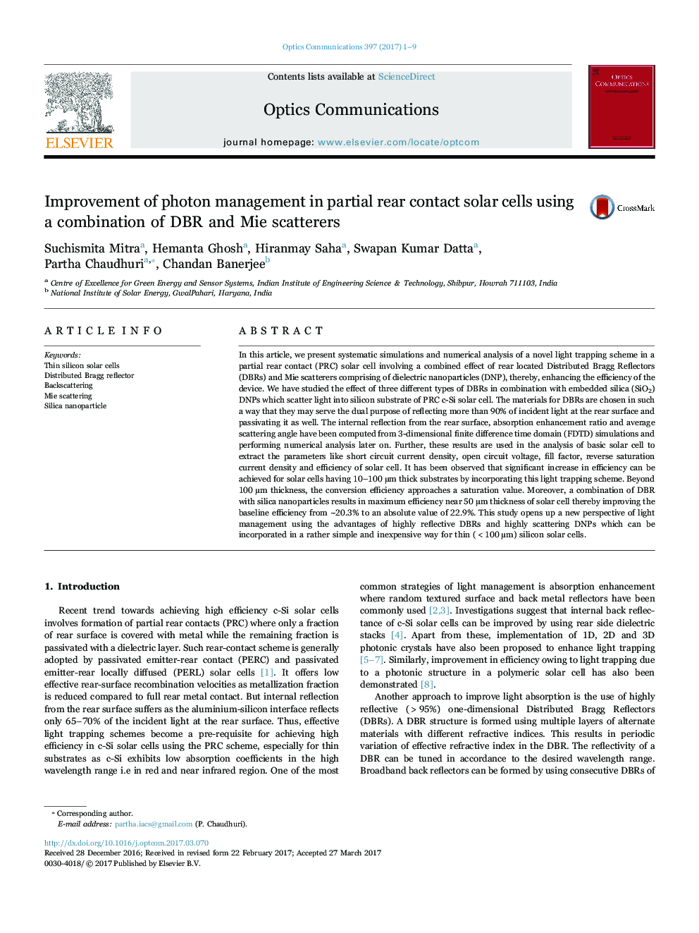 Improvement of photon management in partial rear contact solar cells using a combination of DBR and Mie scatterers