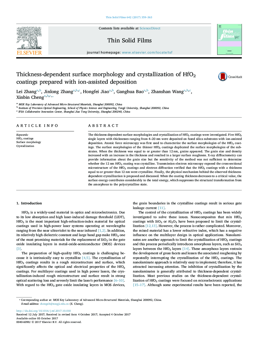 Thickness-dependent surface morphology and crystallization of HfO2 coatings prepared with ion-assisted deposition