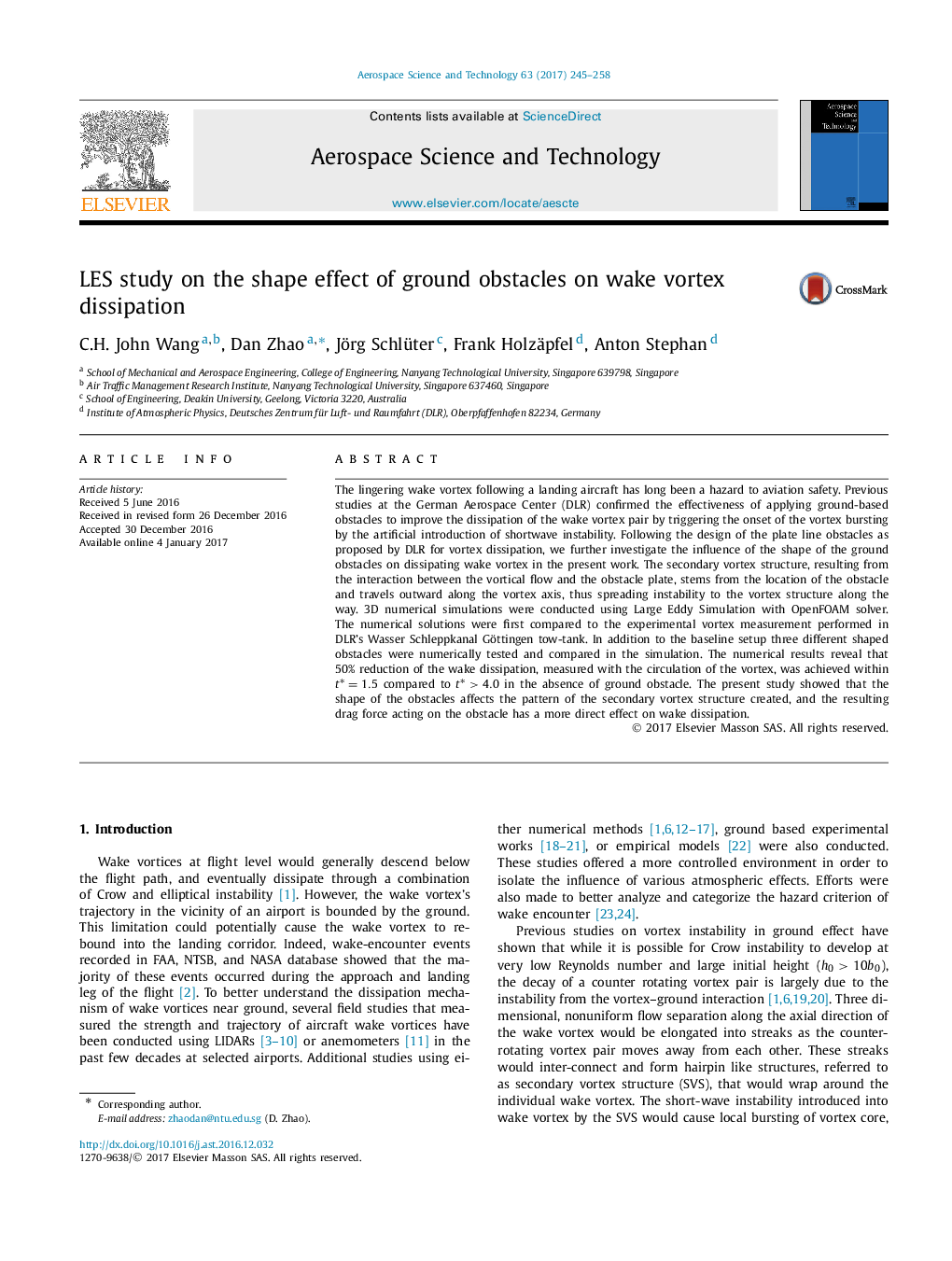 LES study on the shape effect of ground obstacles on wake vortex dissipation