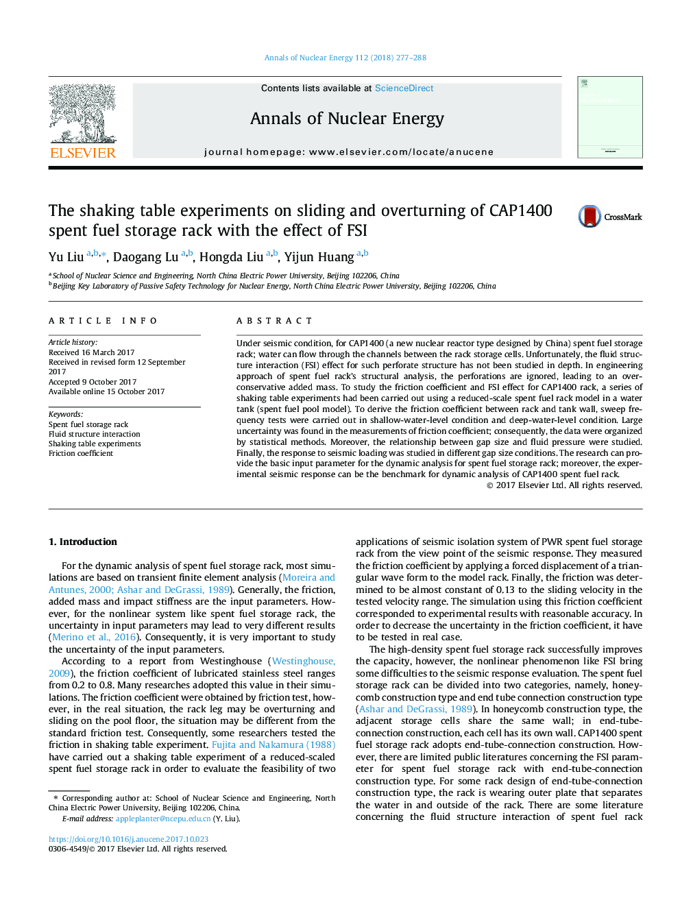 The shaking table experiments on sliding and overturning of CAP1400 spent fuel storage rack with the effect of FSI