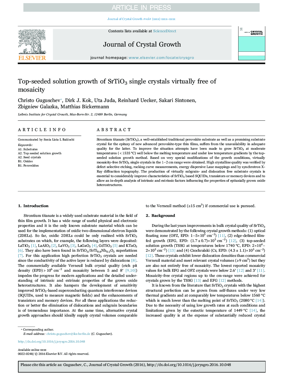 Top-seeded solution growth of SrTiO3 single crystals virtually free of mosaicity