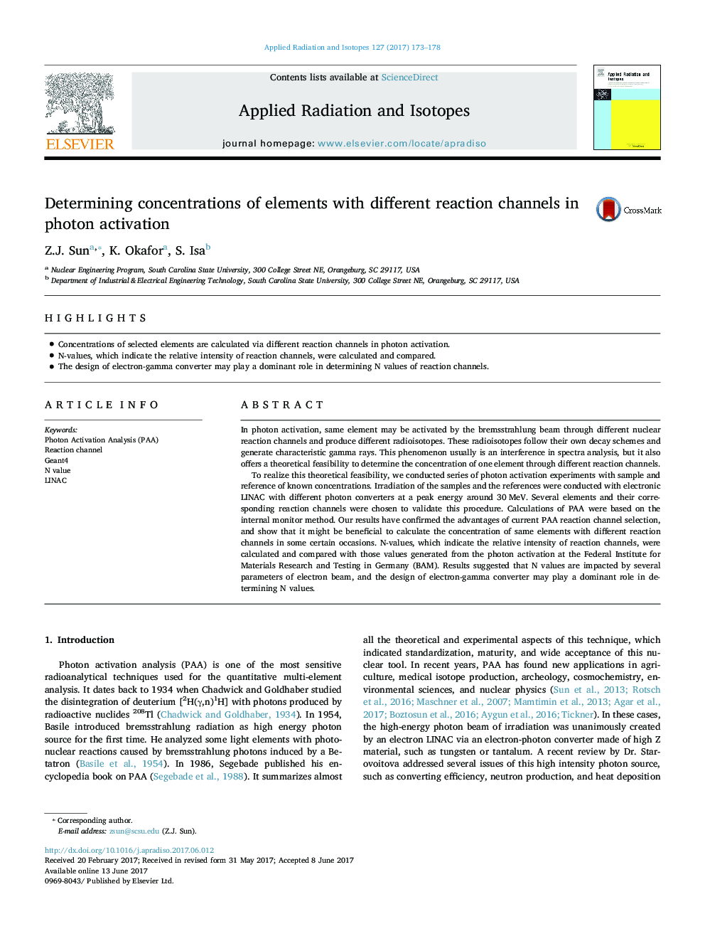 Determining concentrations of elements with different reaction channels in photon activation