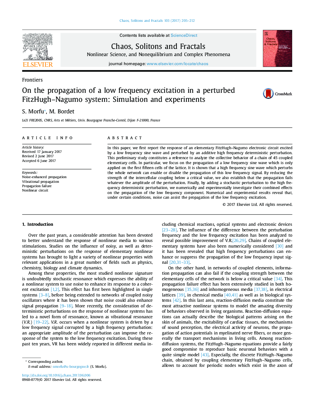 On the propagation of a low frequency excitation in a perturbed FitzHugh-Nagumo system: Simulation and experiments