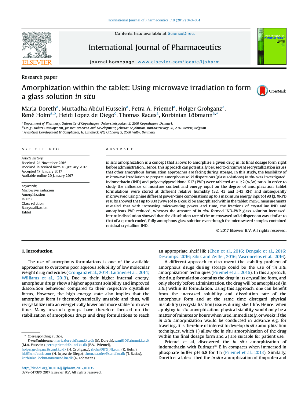 Amorphization within the tablet: Using microwave irradiation to form a glass solution in situ