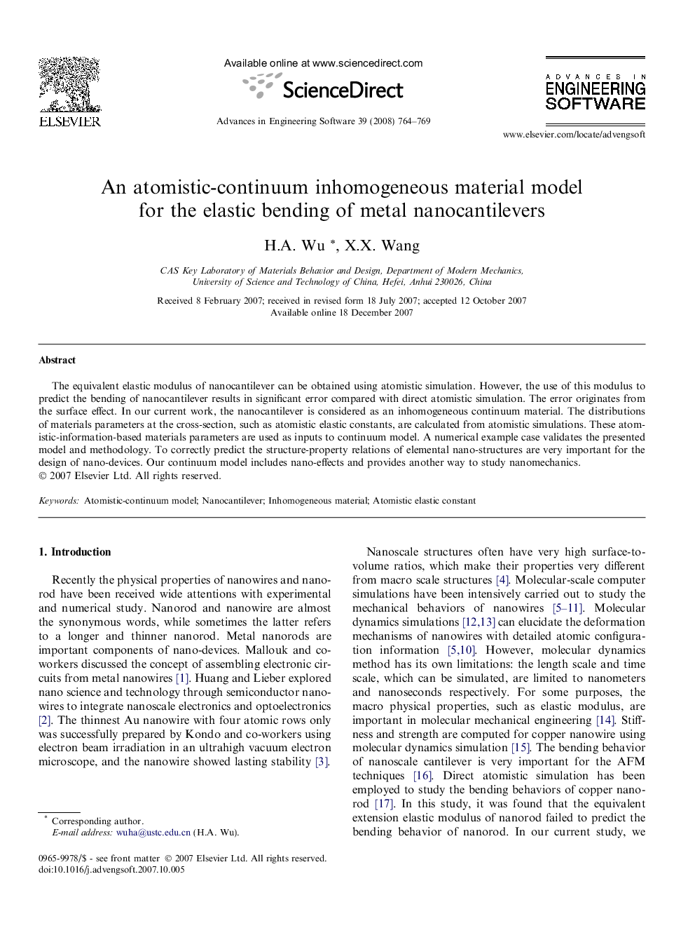 An atomistic-continuum inhomogeneous material model for the elastic bending of metal nanocantilevers