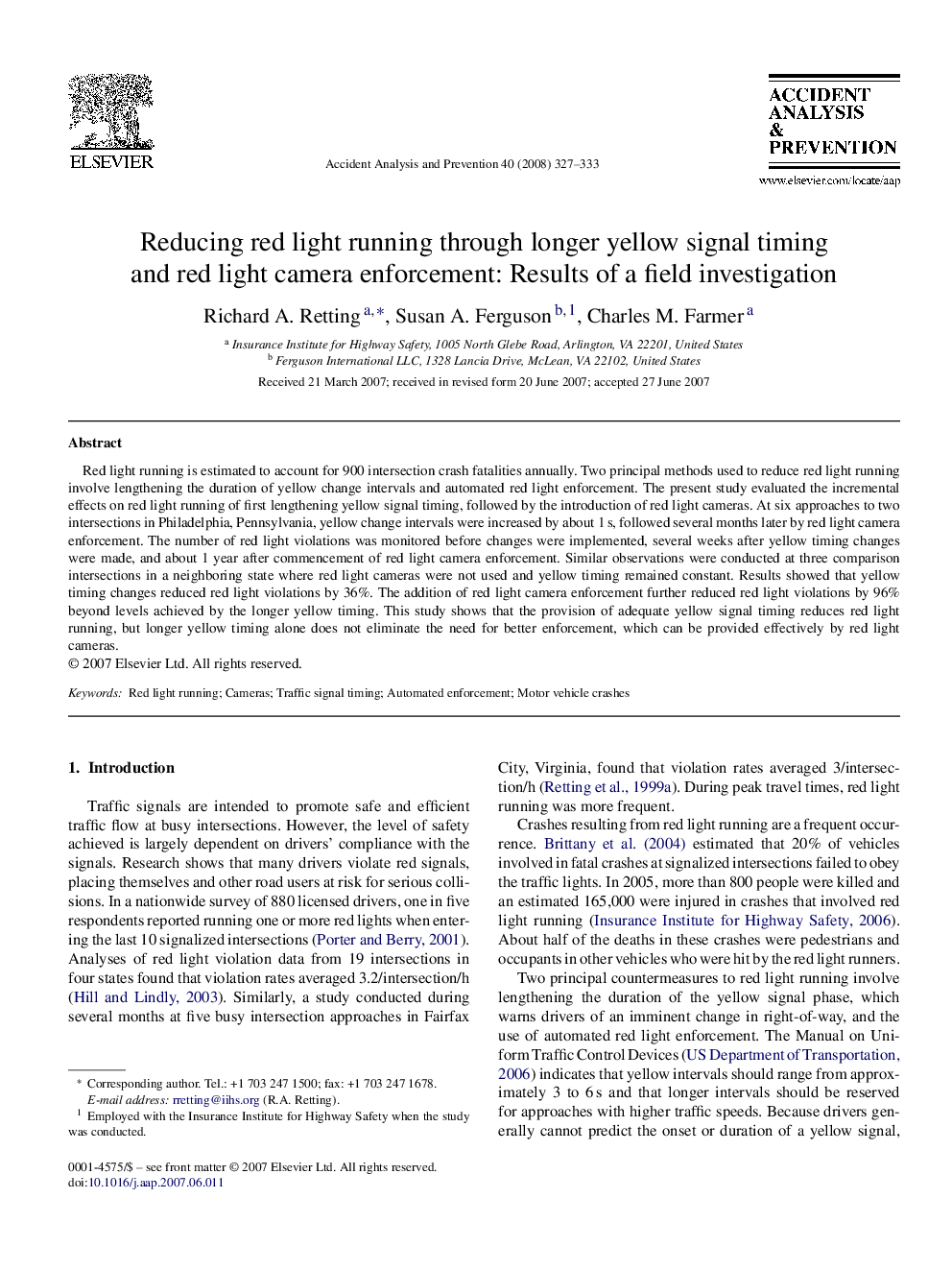 Reducing red light running through longer yellow signal timing and red light camera enforcement: Results of a field investigation