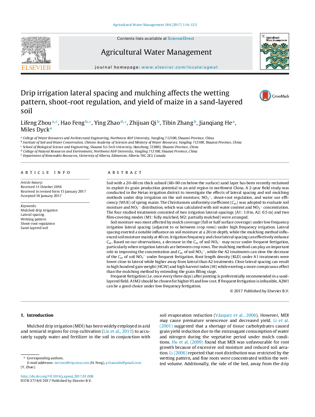 Drip irrigation lateral spacing and mulching affects the wetting pattern, shoot-root regulation, and yield of maize in a sand-layered soil