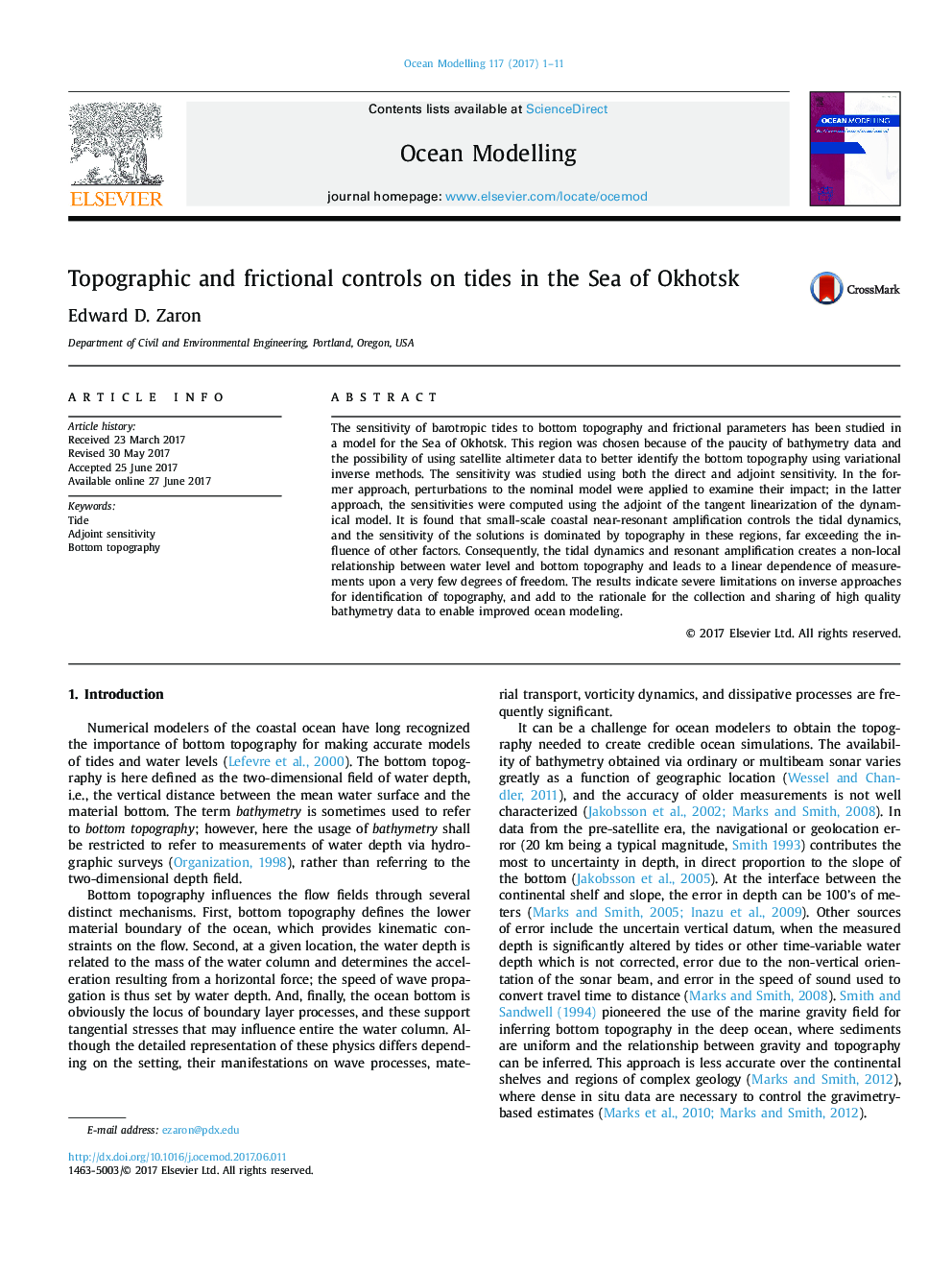 Topographic and frictional controls on tides in the Sea of Okhotsk