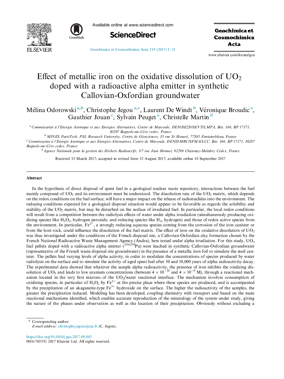 Effect of metallic iron on the oxidative dissolution of UO2 doped with a radioactive alpha emitter in synthetic Callovian-Oxfordian groundwater