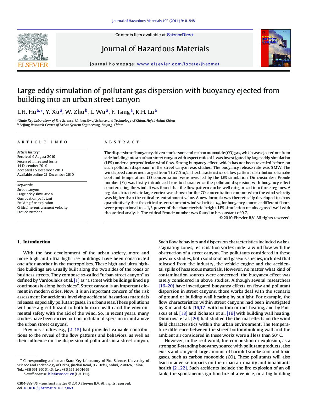 Large eddy simulation of pollutant gas dispersion with buoyancy ejected from building into an urban street canyon