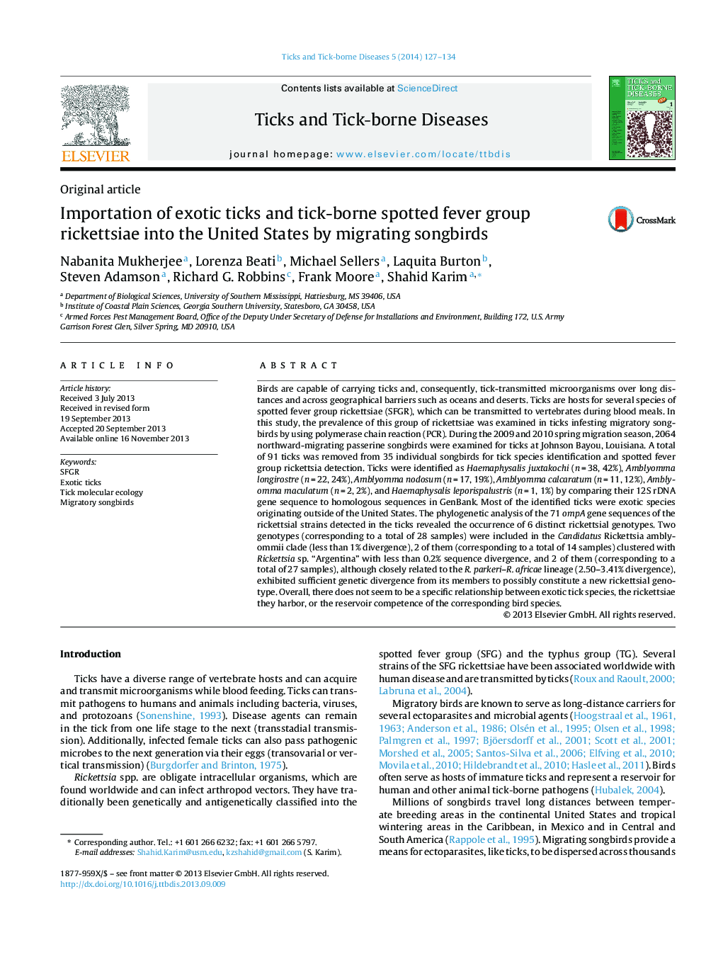 Importation of exotic ticks and tick-borne spotted fever group rickettsiae into the United States by migrating songbirds