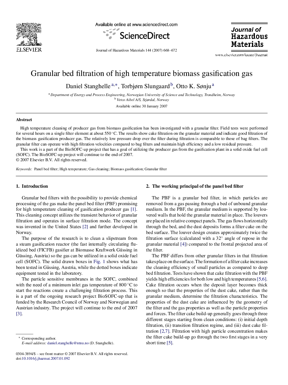 Granular bed filtration of high temperature biomass gasification gas