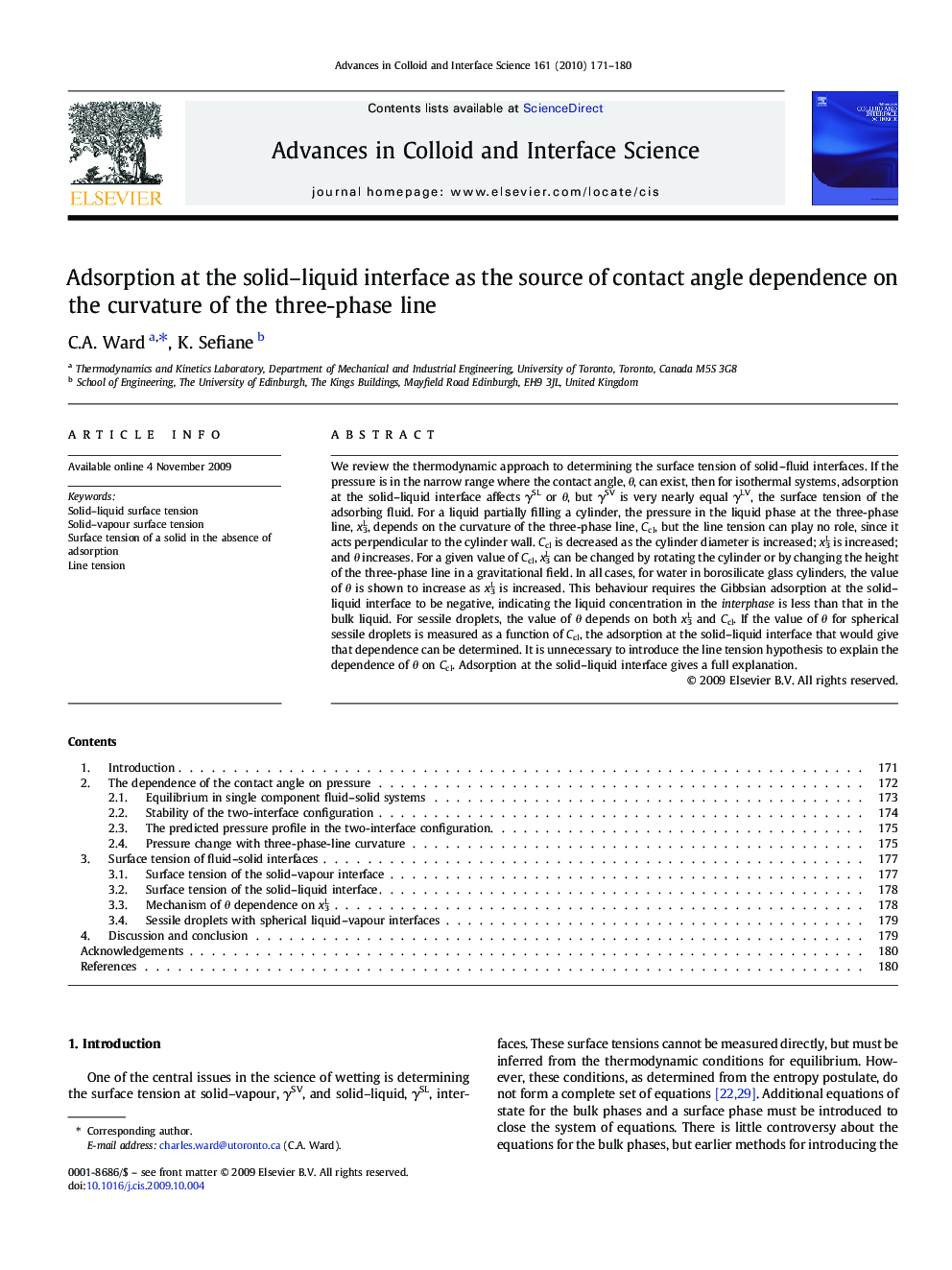 Adsorption at the solid–liquid interface as the source of contact angle dependence on the curvature of the three-phase line