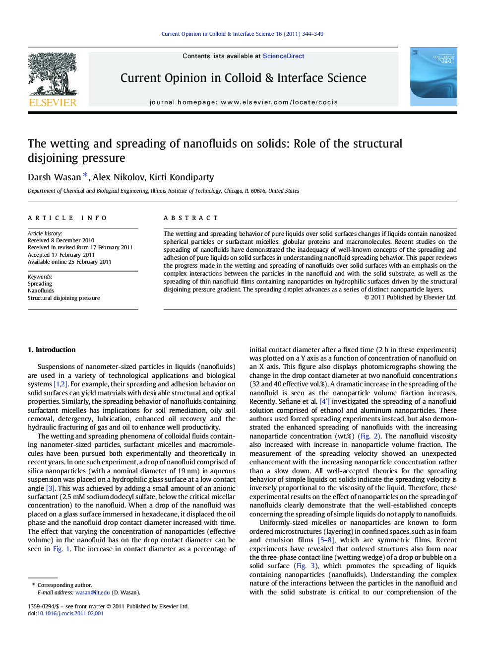 The wetting and spreading of nanofluids on solids: Role of the structural disjoining pressure