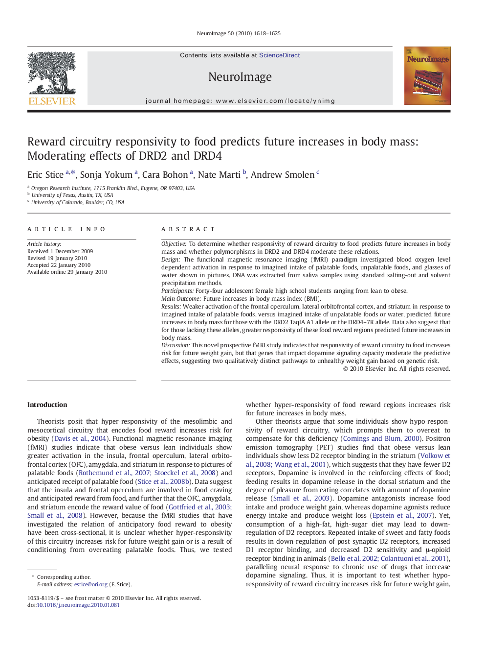 Reward circuitry responsivity to food predicts future increases in body mass: Moderating effects of DRD2 and DRD4