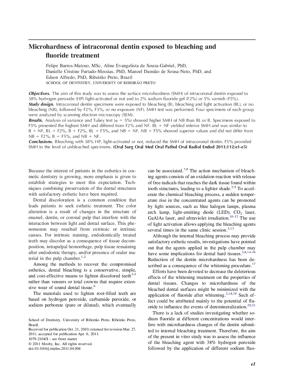 Microhardness of intracoronal dentin exposed to bleaching and fluoride treatment