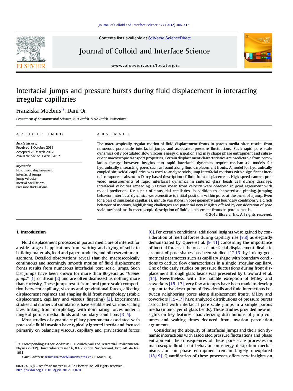 Interfacial jumps and pressure bursts during fluid displacement in interacting irregular capillaries