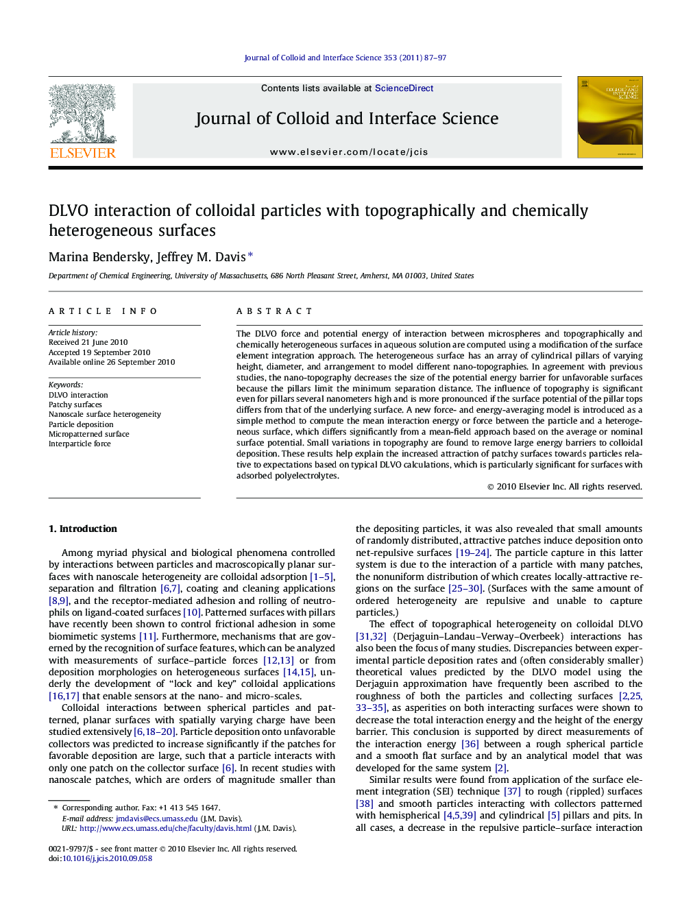 DLVO interaction of colloidal particles with topographically and chemically heterogeneous surfaces