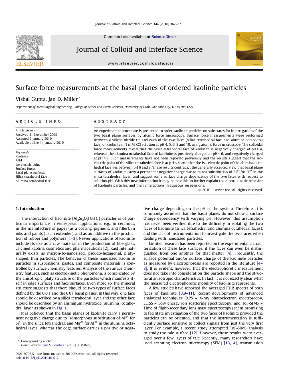 Surface force measurements at the basal planes of ordered kaolinite particles