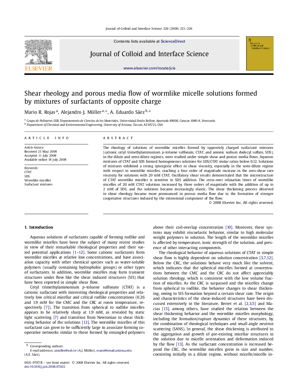 Shear rheology and porous media flow of wormlike micelle solutions formed by mixtures of surfactants of opposite charge