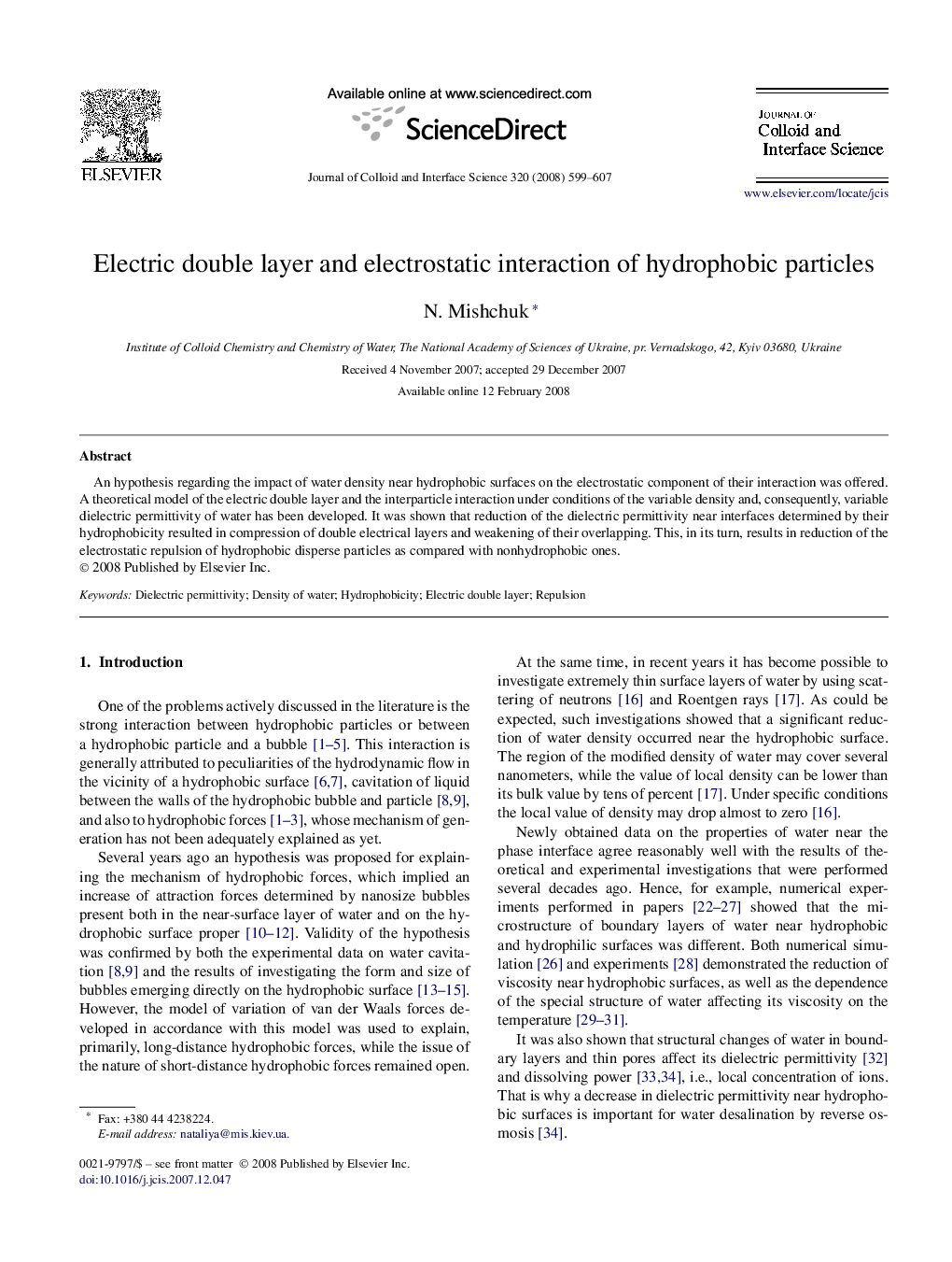 Electric double layer and electrostatic interaction of hydrophobic particles