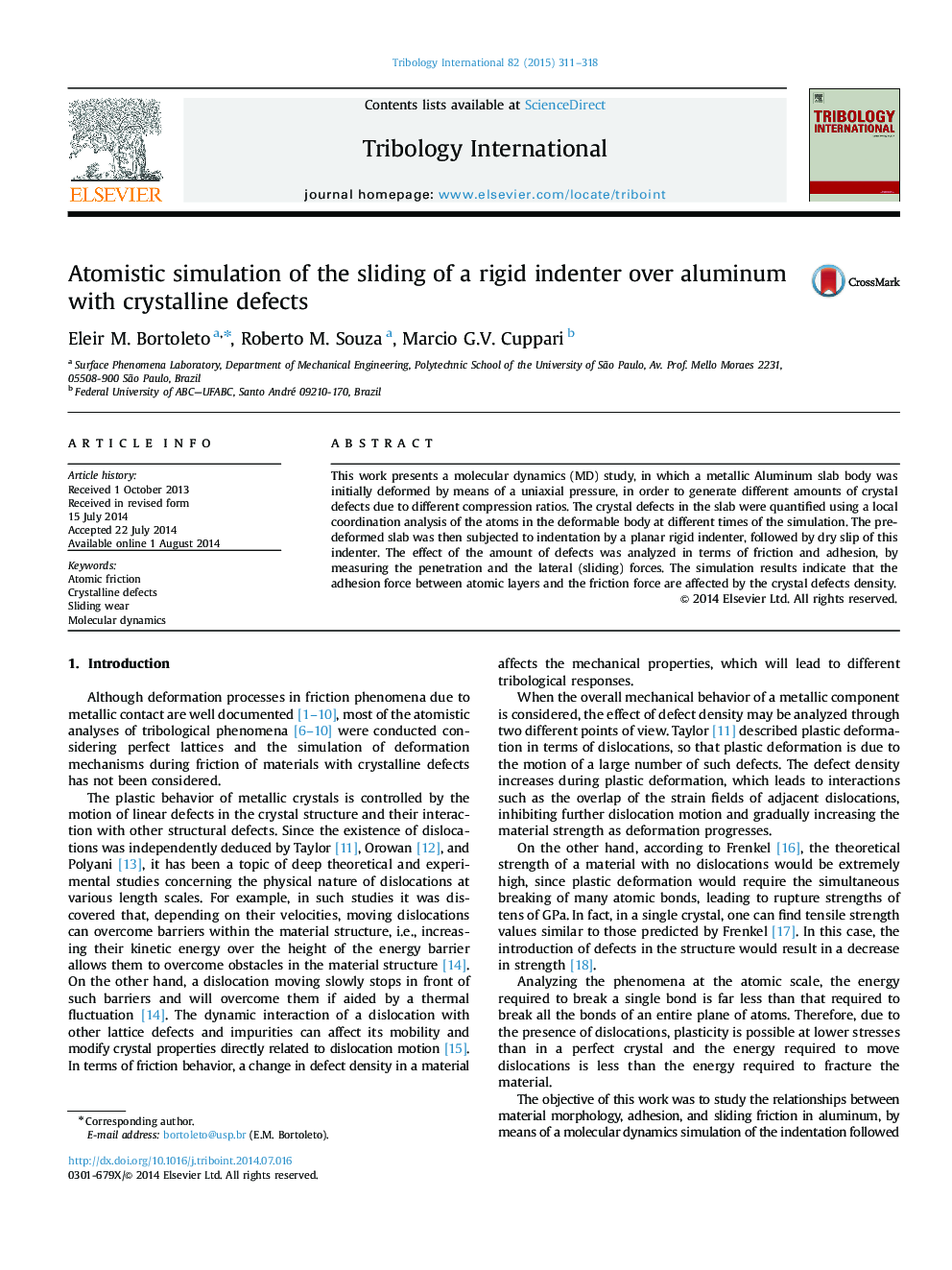 Atomistic simulation of the sliding of a rigid indenter over aluminum with crystalline defects