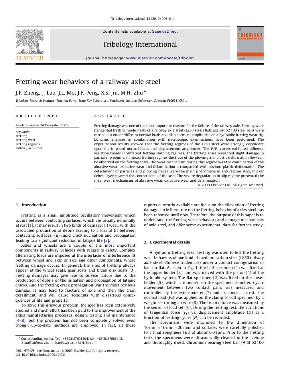 Fretting wear behaviors of a railway axle steel