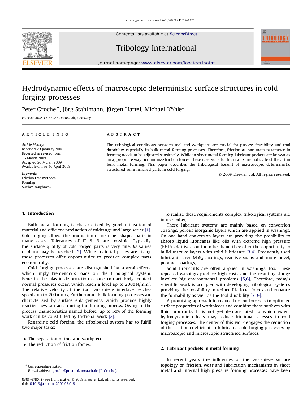 Hydrodynamic effects of macroscopic deterministic surface structures in cold forging processes