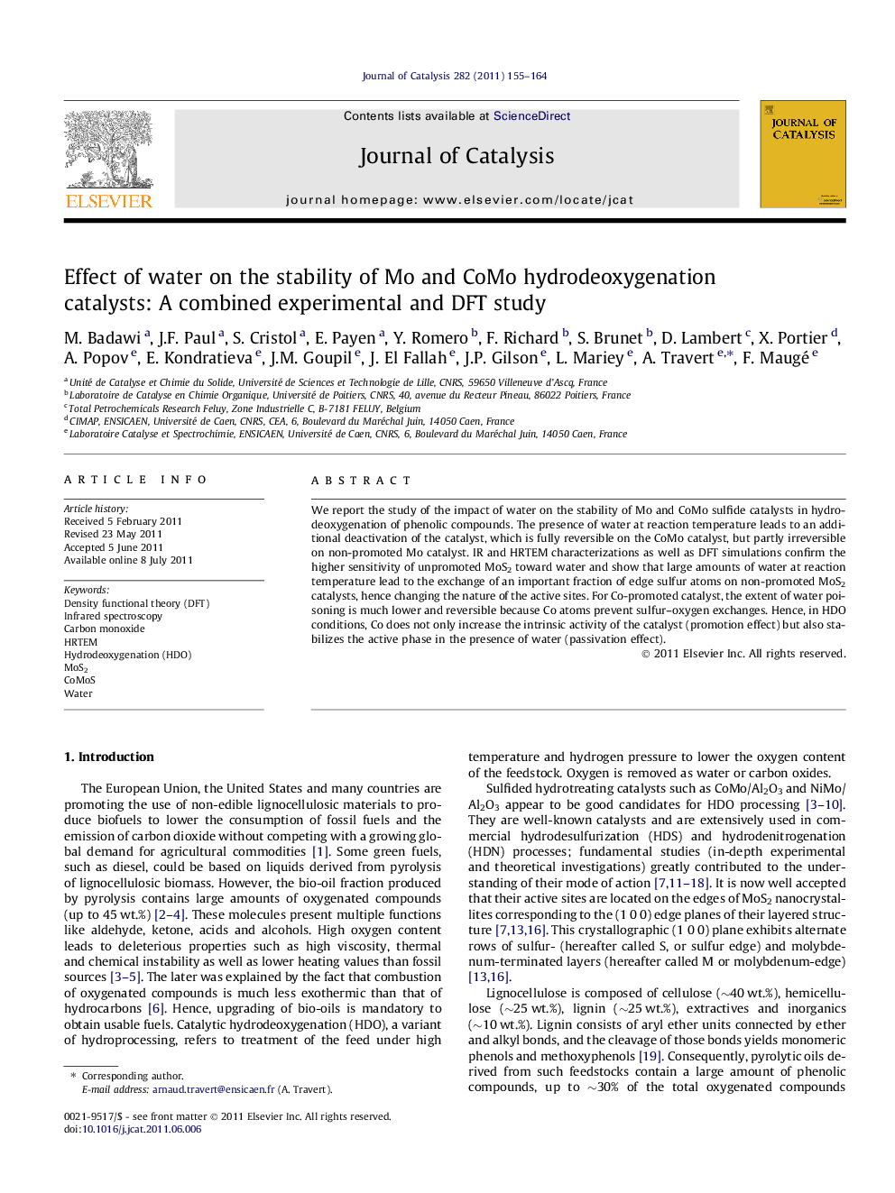 Effect of water on the stability of Mo and CoMo hydrodeoxygenation catalysts: A combined experimental and DFT study