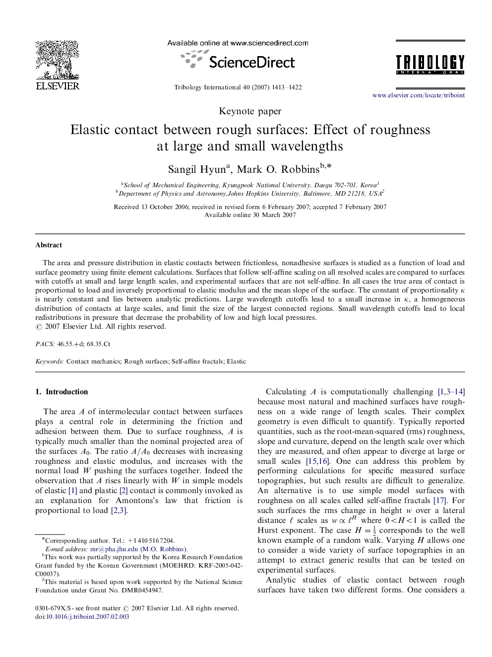 Elastic contact between rough surfaces: Effect of roughness at large and small wavelengths