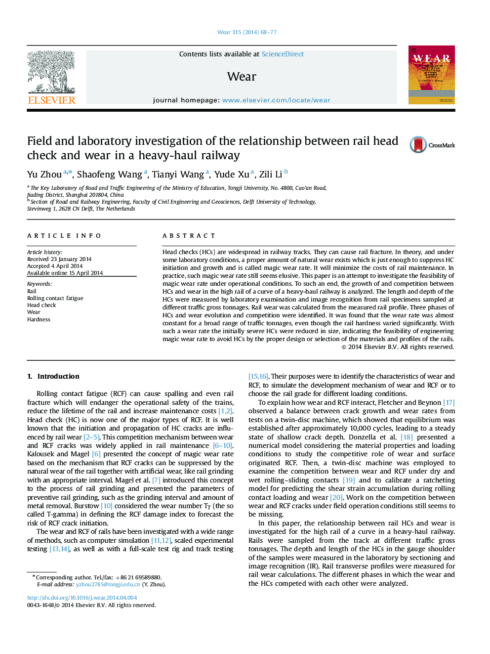 Field and laboratory investigation of the relationship between rail head check and wear in a heavy-haul railway