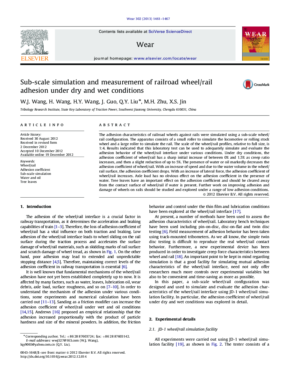 Sub-scale simulation and measurement of railroad wheel/rail adhesion under dry and wet conditions