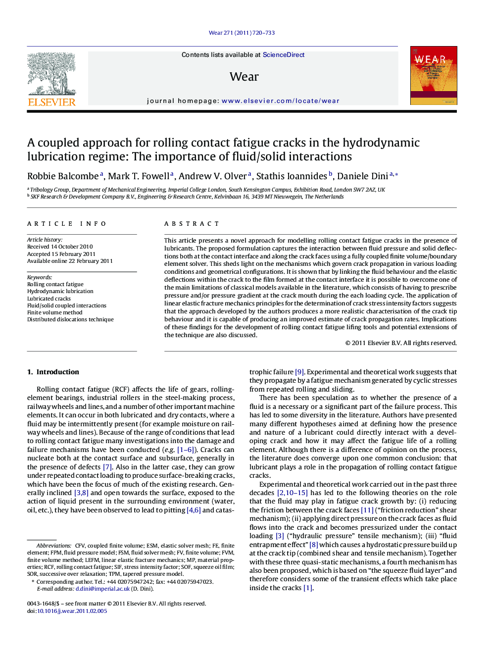 A coupled approach for rolling contact fatigue cracks in the hydrodynamic lubrication regime: The importance of fluid/solid interactions