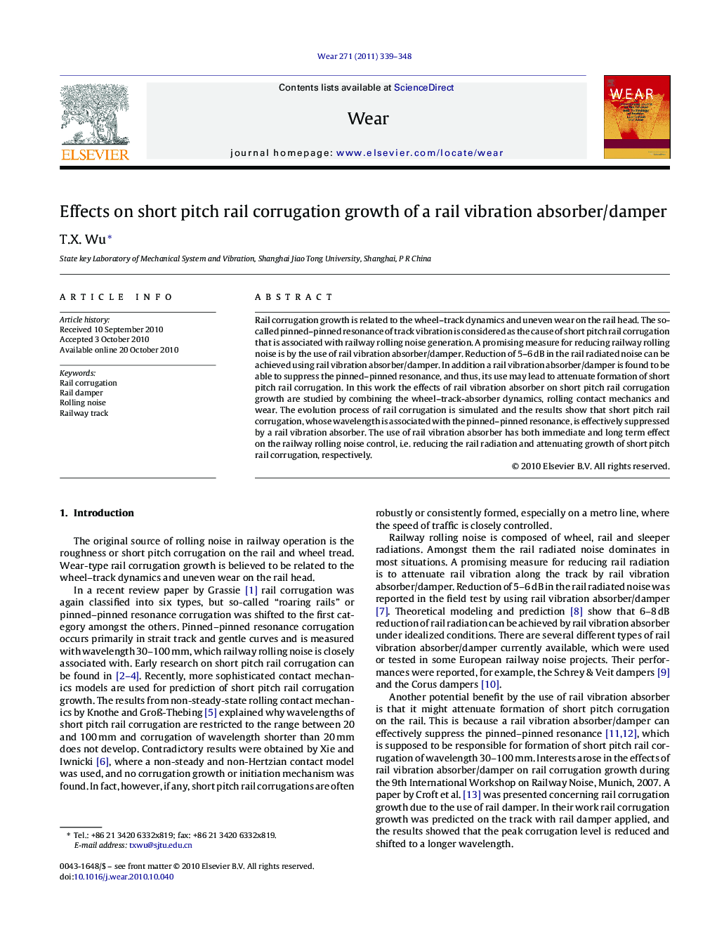 Effects on short pitch rail corrugation growth of a rail vibration absorber/damper