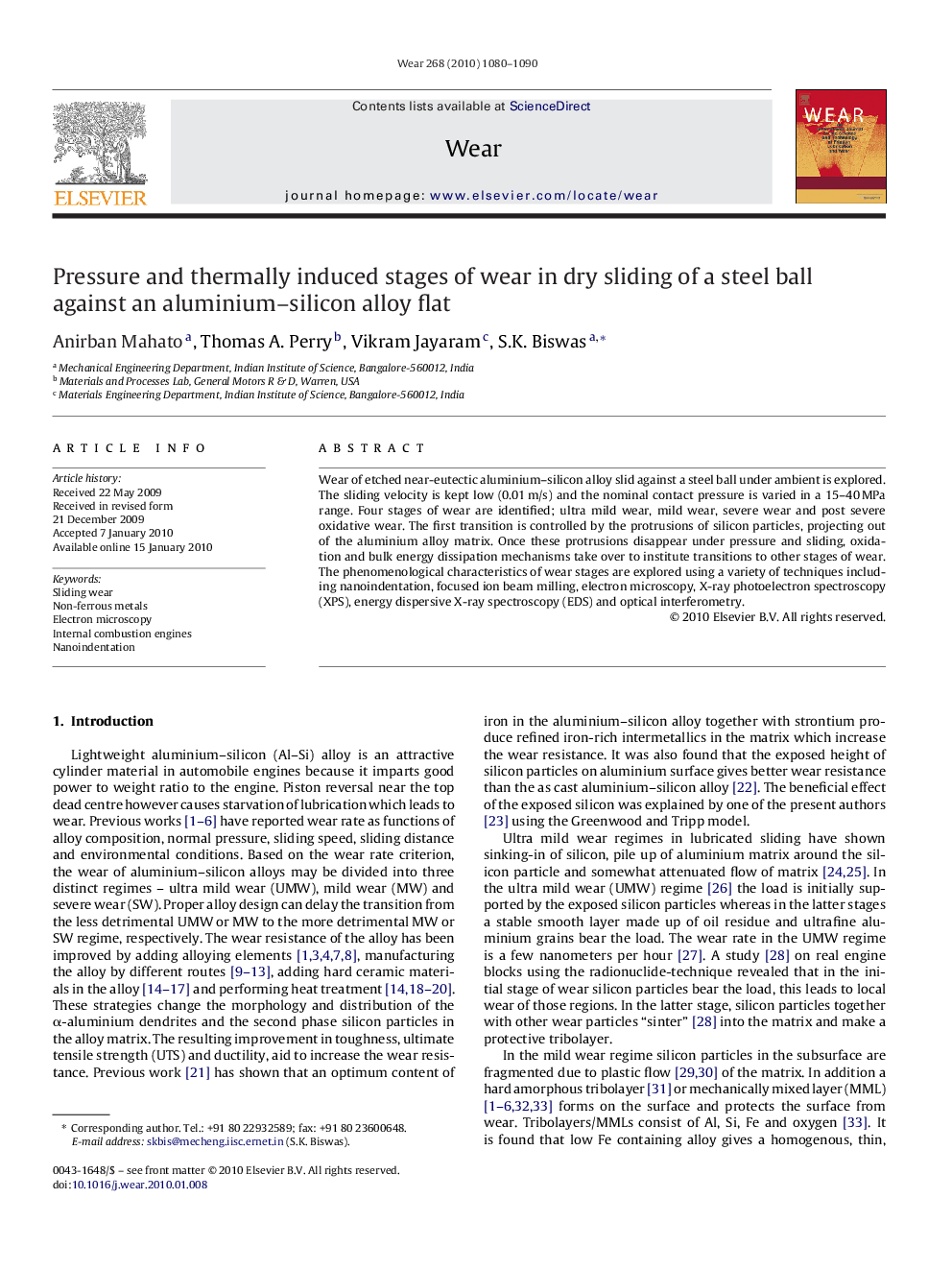 Pressure and thermally induced stages of wear in dry sliding of a steel ball against an aluminium-silicon alloy flat