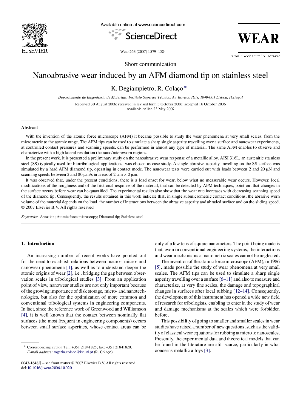 Nanoabrasive wear induced by an AFM diamond tip on stainless steel