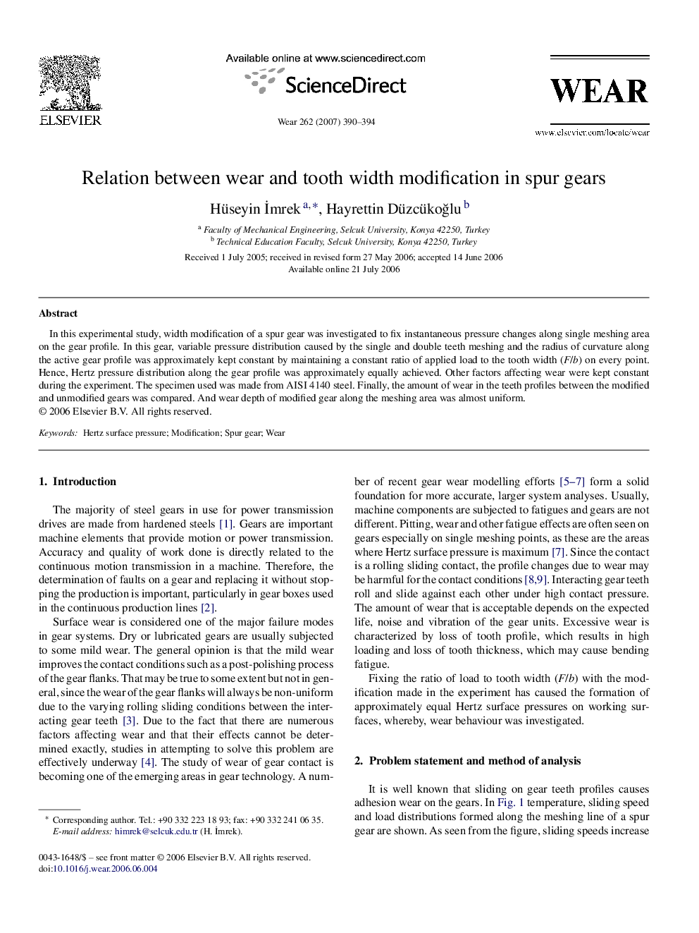 Relation between wear and tooth width modification in spur gears