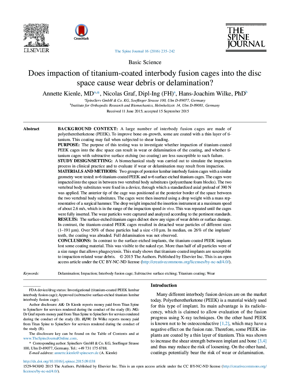 Does impaction of titanium-coated interbody fusion cages into the disc space cause wear debris or delamination?