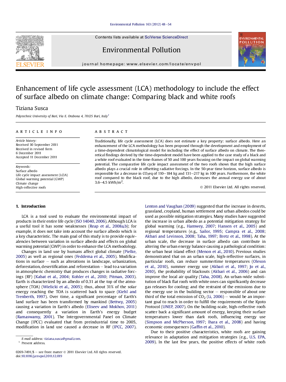 Enhancement of life cycle assessment (LCA) methodology to include the effect of surface albedo on climate change: Comparing black and white roofs