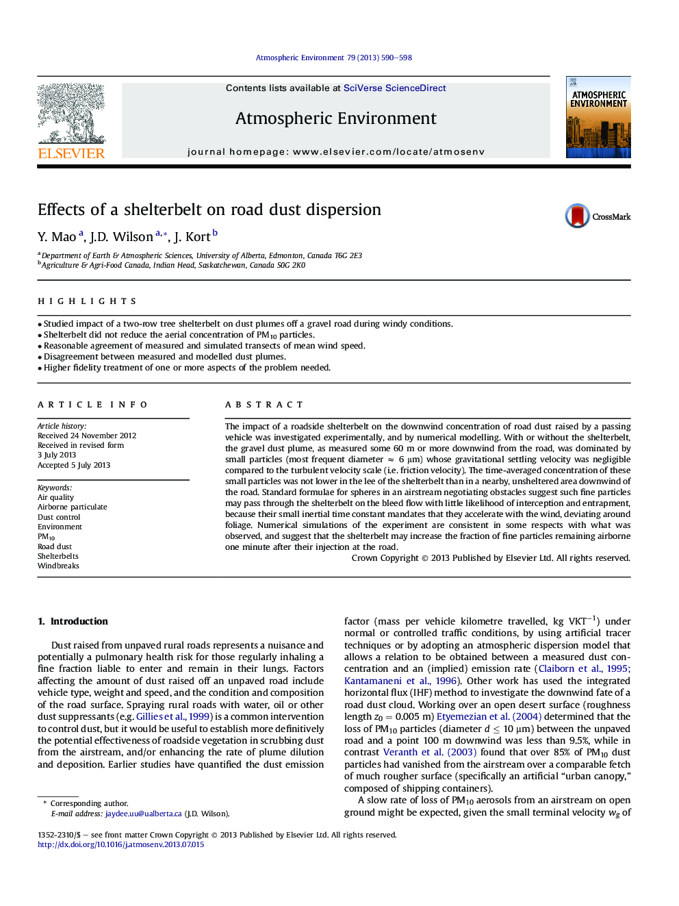 Effects of a shelterbelt on road dust dispersion