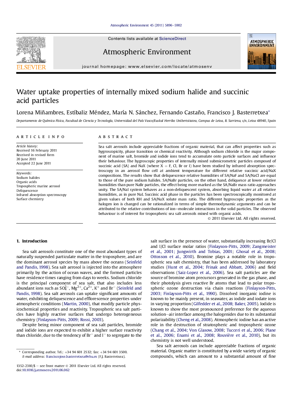 Water uptake properties of internally mixed sodium halide and succinic acid particles