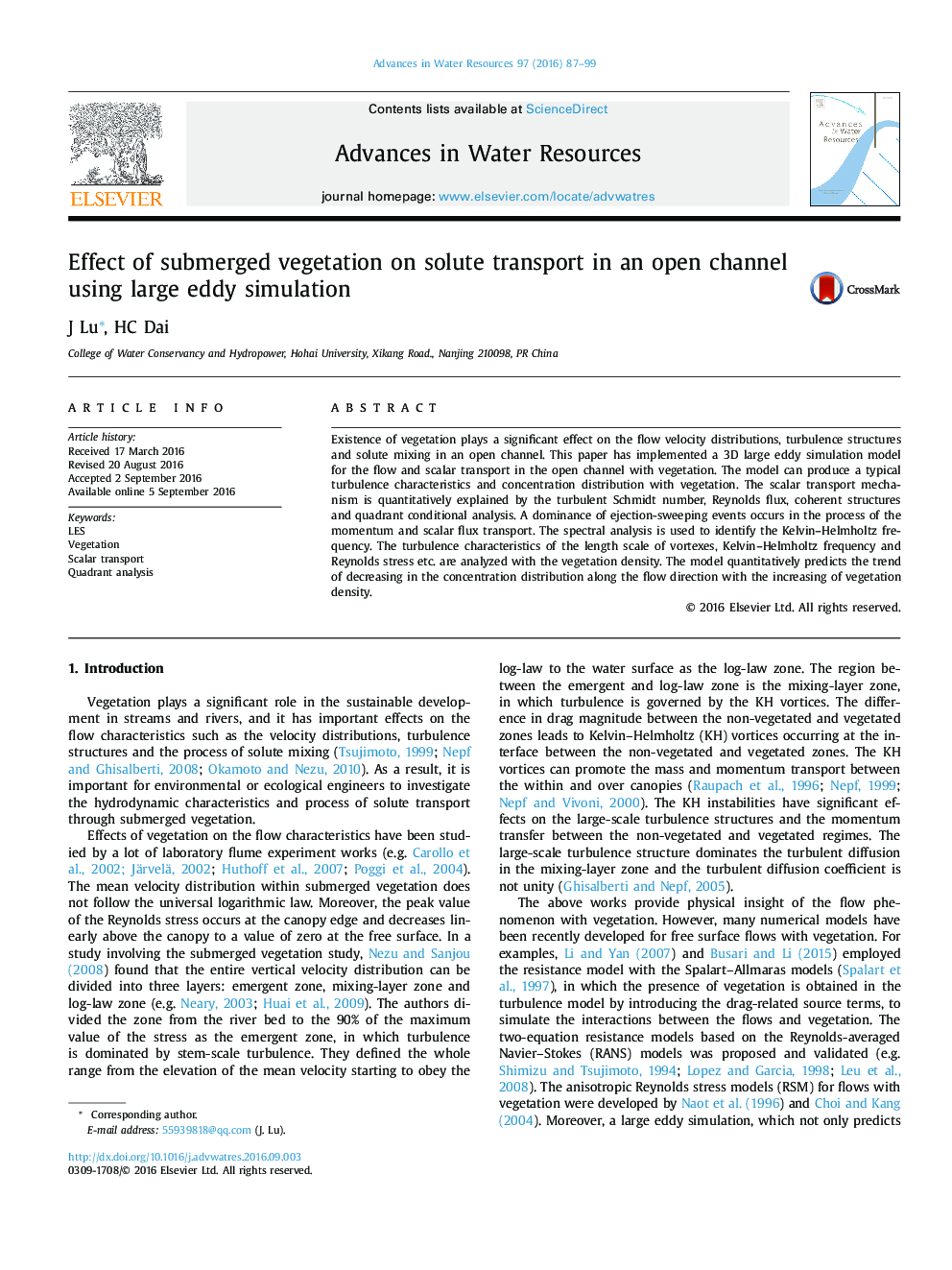 Effect of submerged vegetation on solute transport in an open channel using large eddy simulation