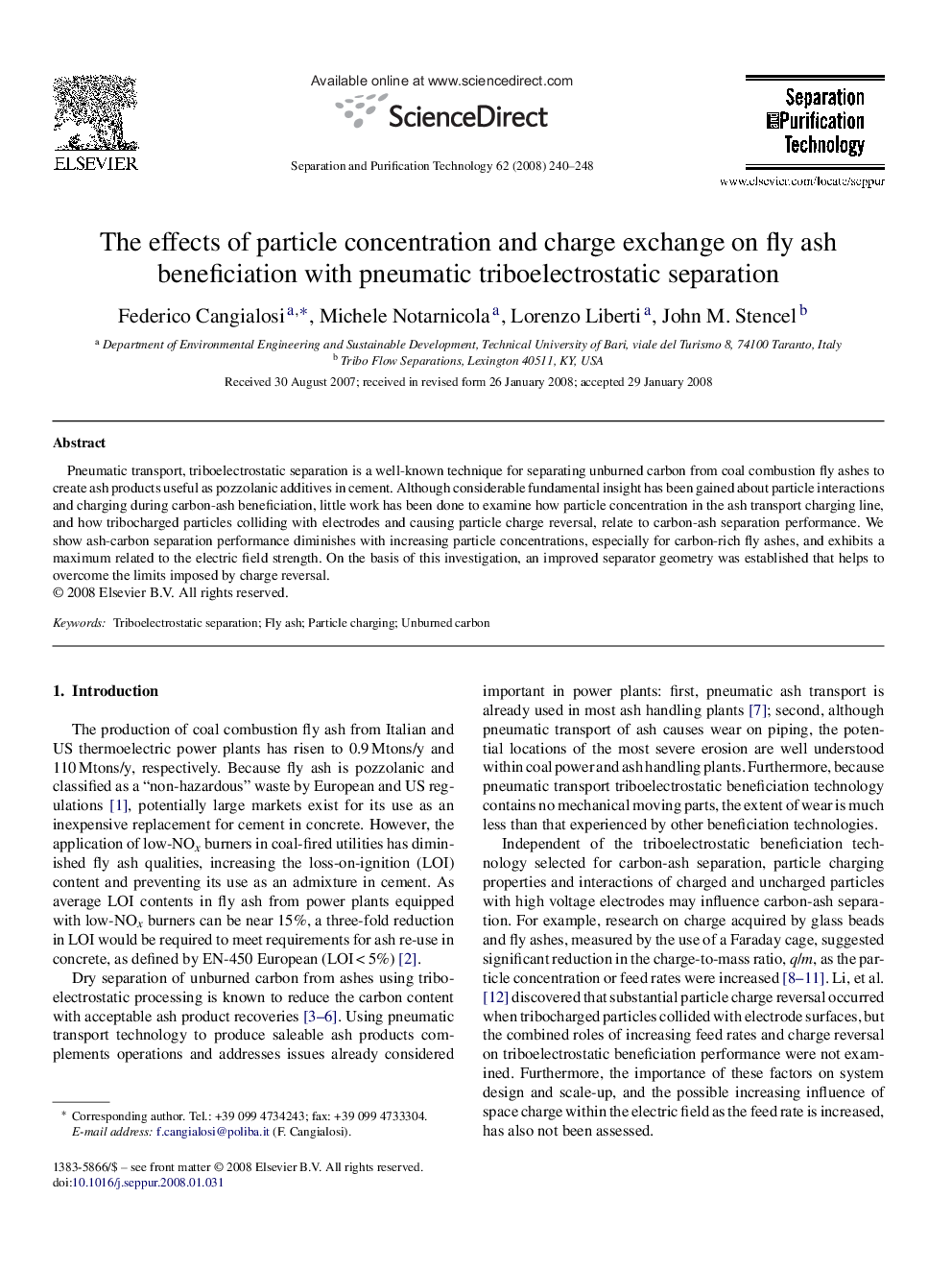 The effects of particle concentration and charge exchange on fly ash beneficiation with pneumatic triboelectrostatic separation