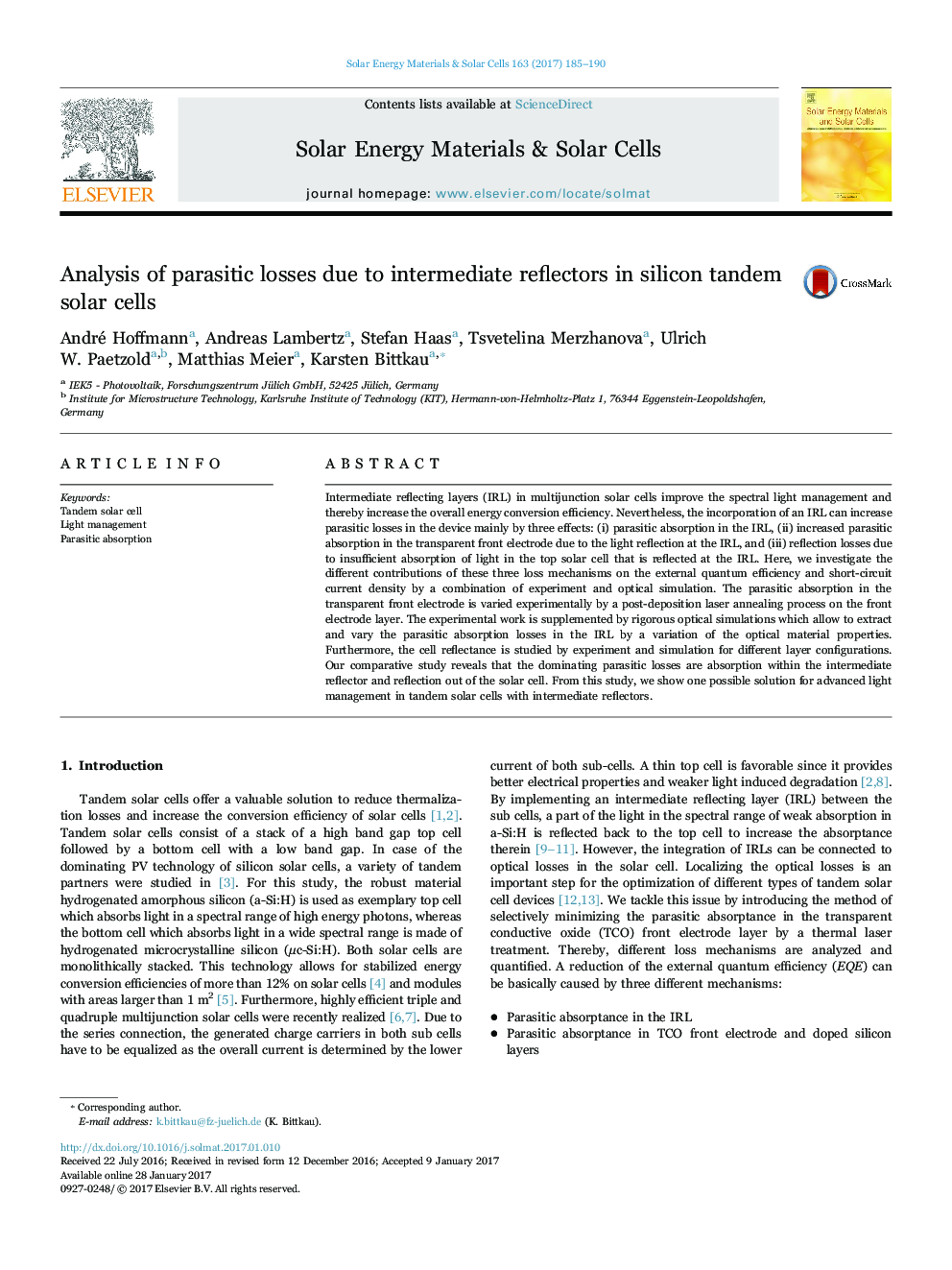 Analysis of parasitic losses due to intermediate reflectors in silicon tandem solar cells